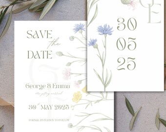 May include: A set of wedding stationery featuring floral illustrations and the text "Save the Date." The design includes blue, pink, and yellow wildflowers with green foliage. The date "30 05 25" is displayed on a separate card.