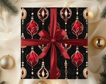 May include: A wrapped gift with a black background featuring a pattern of red and gold Christmas ornaments. A burgundy ribbon is tied in a bow around the gift. Gold ornaments and pine branches are in the background.
