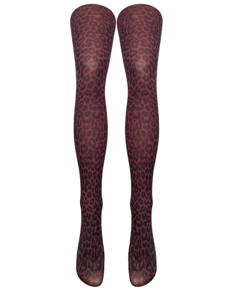 May include: A pair of brown tights with a black leopard print pattern.