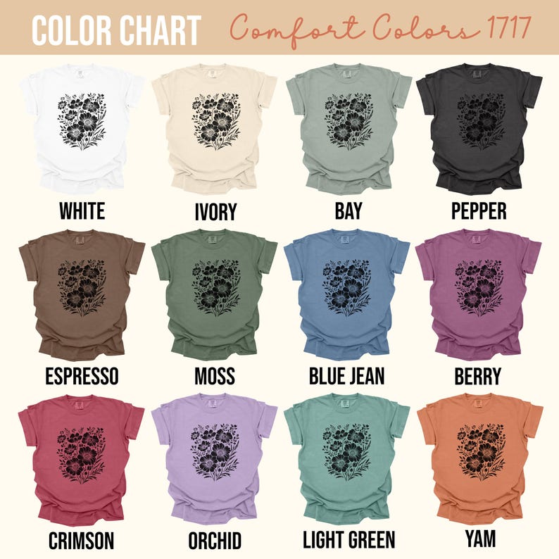May include: A color chart of Comfort Colors 1717 t-shirts. Each shirt displays a black floral design. Colors include white, ivory, bay, pepper, espresso, moss, blue jean, berry, crimson, orchid, light green, and yam.
