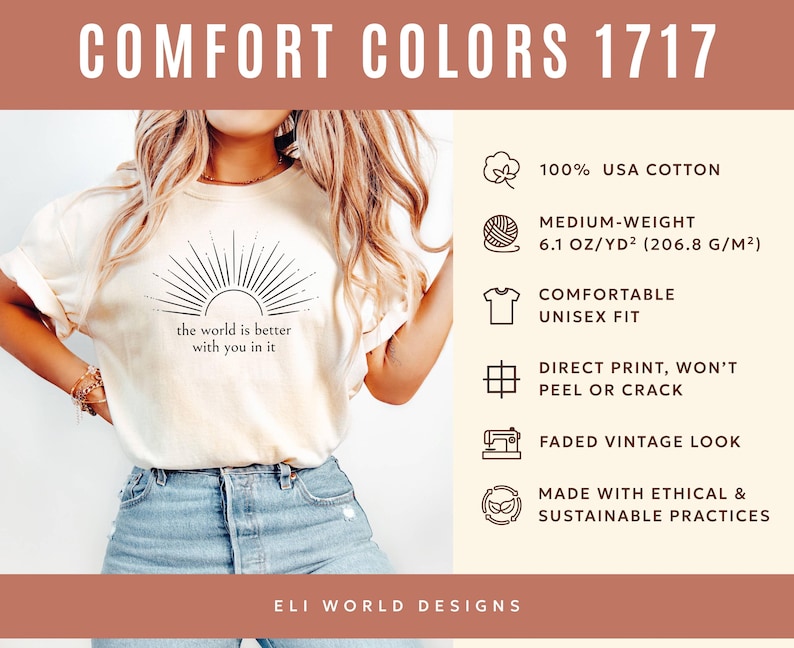 Op de afbeelding: Cr&egrave;mekleurig unisex T-shirt met de tekst "the world is better with you in it" en een zonnestraalontwerp. Het shirt is gemaakt van 100% USA katoen, is van gemiddeld gewicht en heeft een verweerde vintage look. De print is direct en zal niet afbladderen.