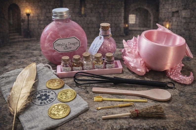 A pink-themed sleeping dragon potion set featuring a large bottle labeled Sleeping Dragon Elixir, a pink dragon-shaped cauldron, five small glass jars, and wooden and metal crafting tools.