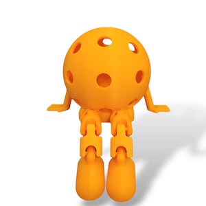 May include: A bright orange, spherical, 3D-printed toy with multiple circular holes. The toy has articulated legs and arms, giving it a playful appearance. The design is simple and modern, with a smooth, matte finish. The toy is sitting, with its legs dangling.