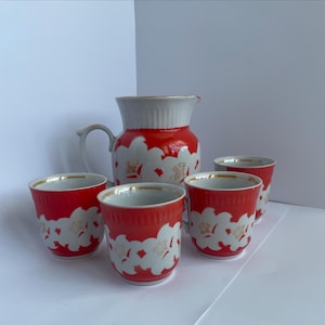 Vintage porcelain jug and 4 cups