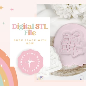 May include: A pink book stack with bow design, next to a white cookie cutter. The image includes text that reads "Digital STL File" and "Book Stack with Bow". A pink logo with text "The Sweet Side Designer" is also visible.