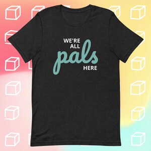 Puede incluir: Camiseta negra con el texto "We're all pals here" en letras blancas y azul turquesa.