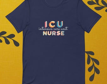 May include: Navy blue t-shirt with the text "ICU intensive care unit NURSE" in colorful letters. The design features a playful font and is centered on the front of the shirt. The shirt is made of a soft material.