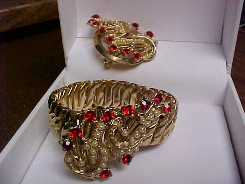 Expansion bracelet and matching brooch with red rhinestones and faux pearls