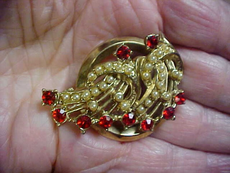 Expansion bracelet and matching brooch with red rhinestones and faux pearls
