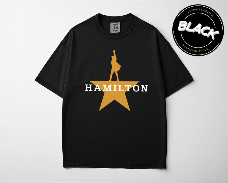 A black t-shirt with a yellow star and the word "HAMILTON" printed on it.