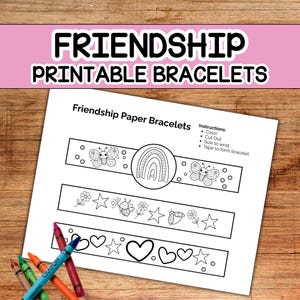May include: A white sheet with the text "FRIENDSHIP PRINTABLE BRACELETS" and "Friendship Paper Bracelets". The sheet has three bracelet designs with butterflies, rainbows, stars, and hearts. Crayons are in the lower left corner.
