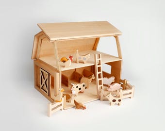 May include: A two-story wooden barn playset featuring a slanted roof, a ladder, and a fenced-in area. The set includes various small wooden animal figures, including a cow, sheep, pig, chicken, and cat, arranged inside and around the structure.
