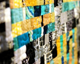 Original improv art quilt, blue and yellow strips against black-and-white background