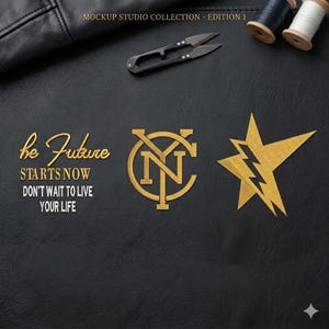 May include: A black leather surface with gold embroidered designs and text. The text reads "he Future STARTS NOW DON'T WAIT TO LIVE YOUR LIFE." Other designs include a star and a logo with the letters "NY".