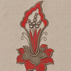 May include: Embroidered floral design in red, brown, and white on a tan fabric background. The design features a stylized flower with intricate details, including a layered petal structure and decorative elements.