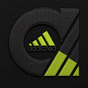 May include: A black fabric surface featuring an embroidered logo. The design consists of a large black letter C with a lime green three-stripe mountain graphic inside, the word addicted in black text, and two diagonal lime green stripes below.