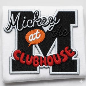 May include: A white fabric patch featuring a large black letter M with a white border. The embroidery includes the white text Mickey at the, an orange oval with the white text at, and the red text CLUBHOUSE curved across the bottom section.