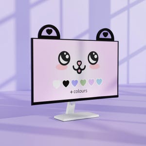 Peut inclure: Un écran d'ordinateur rose avec un visage d'ours de dessin animé. Le moniteur a des bordures noires et un support blanc. L'écran affiche des cœurs de couleurs et le texte "+ couleurs".