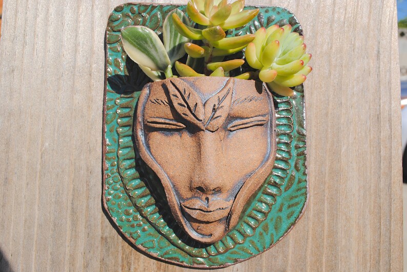 pottery faces garden