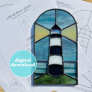 May include: A stained glass pattern for a lighthouse suncatcher. The pattern is printed on white paper with a black border. The pattern includes 13 pieces of glass. The pattern is titled "Lighthouses Stained Glass Pattern".