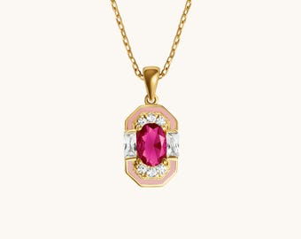 May include: A gold-colored necklace with a pendant featuring a large, oval, magenta-colored gemstone. The pendant is surrounded by a pink border, white rectangular stones, and small clear stones. The necklace chain is also gold-colored.