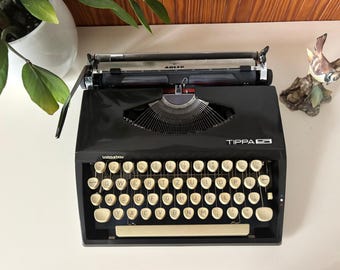 Zwarte Triumph Tippa typemachine