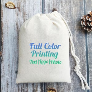 May include: A white drawstring bag with the text "Full Color Printing Text | Logo | Photo" printed on the front.