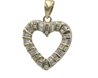 May include: A gold heart-shaped pendant with a diamond-encrusted border. The diamonds are baguette-shaped and set in a pave setting.