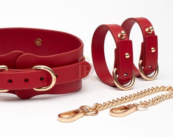 Rött läderbältesset, bondagehalsband med koppel, handbojor