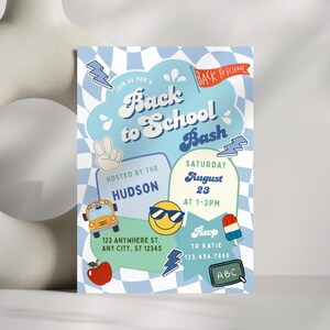May include: A rectangular Back to School Bash invitation card featuring a light blue and white checkered background. The design includes illustrations of a yellow school bus, a red apple, a smiley face with sunglasses, a popsicle, and lightning bolts.