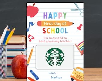 May include: A rectangular card with a white lined paper background featuring a red apple, scissors, a pencil, and a school bus. The text reads Happy First day of SCHOOL, I'm so excited to have you as my teacher!, and Love, Madison. A Starbucks gift card is attached.