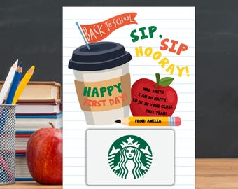 May include: A rectangular card with a lined paper background featuring a coffee cup with the text HAPPY FIRST DAY, a red apple with the text MRS. SMITH I AM SO HAPPY TO BE IN YOUR CLASS THIS YEAR, a pencil labeled FROM: AMELIA, and a Starbucks gift card.
