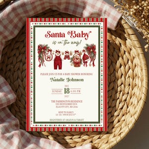 May include: A rectangular baby shower invitation card with a red and green border. The text reads Santa Baby is on the way! honoring Natalie Johnson on Sunday, Dec 18, 2027, at 6:00 PM at The Farmington Residence, 5505 Montgomery Run, Ellicott City, MD 21044.