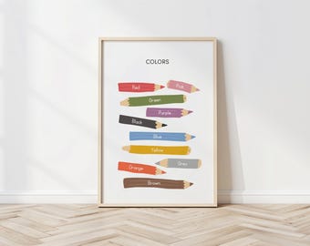 May include: A framed print featuring colorful pencils labeled with the word "COLORS". The pencils are in shades of red, green, black, purple, blue, yellow, orange, brown, pink, and gray. The print is displayed against a white wall.