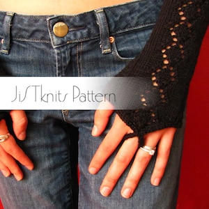 May include: A pair of black fingerless gloves with a lacy pattern. The gloves are worn by a person wearing blue jeans. The text "JisTKnits Pattern" is visible on a white banner.