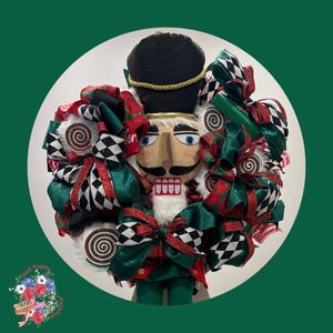 Nutcracker, whimsical nutcracker, holiday nutcracker, Christmas wreath, handmade, evergreen, faux candy lollipops, and holiday home decor