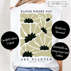 Puede incluir: Camiseta blanca Comfort Colors con un diseño floral en verde oliva y negro. El texto "BLOOM WHERE YOU ARE PLANTED" está impreso en la camiseta, junto con el versículo bíblico Isaías 37:31. Disponible en muchas tallas y colores.