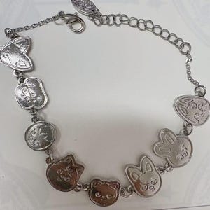 The SKZOO-inspired skzoo bracelet, featuring adorable animal charms and an adjustable silver chain, is the perfect gift for any fan.