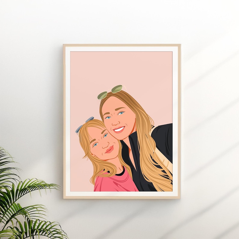 May include: A framed portrait of two smiling people, a woman and a child, with blonde hair and blue eyes. The woman wears sunglasses on her head and a black top. The child wears a pink shirt. The background is a soft pink.