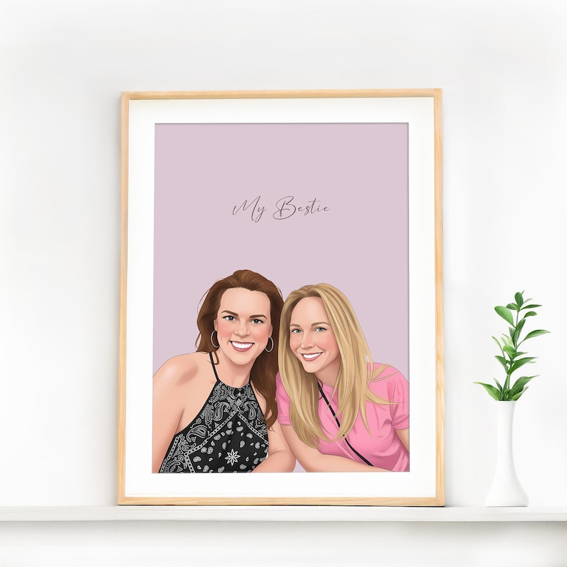 May include: A framed portrait featuring two women. One woman wears a black and white patterned top, the other a pink shirt. The text "My Bestie" is written in cursive at the top of the image.