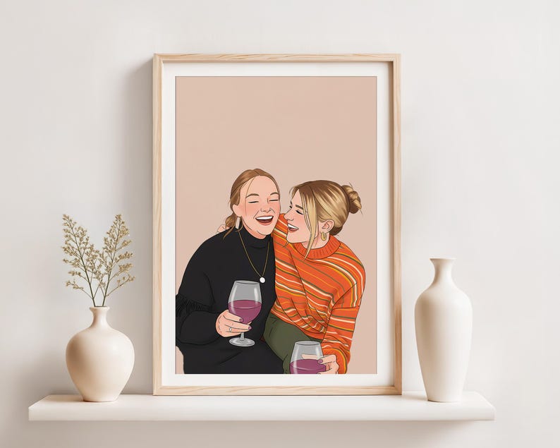 May include: A framed art print featuring a digital illustration of two laughing people holding wine glasses. One person wears a black sweater, the other an orange striped sweater. The background is a solid peach color.