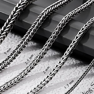 May include: Five silver foxtail chains of different widths, labeled with their measurements in millimeters: 1.5 mm, 2 mm, 2.5 mm, 3 mm, and 3.3 mm. The chains are 925 Sterling Silver.