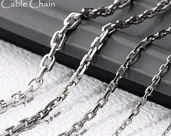 May include: Five 925 sterling silver cable chains of varying thicknesses, labeled 5 mm, 3.8 mm, 3 mm, 2.5 mm, and 2 mm. The silver chains are arranged in a row, showcasing the different link sizes from thickest to thinnest in a metallic finish.
