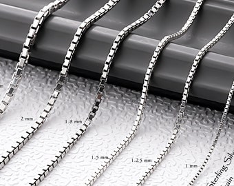 May include: Six silver-colored box chains of varying thicknesses, labeled 2.5 mm, 2 mm, 1.8 mm, 1.5 mm, 1.25 mm, and 1 mm. The chains are arranged side-by-side, displaying a square link design. Text on the image reads 925 Sterling Silver Box Chain.