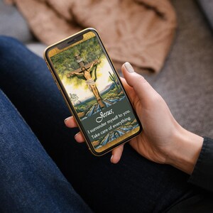 May include: A smartphone displaying a religious image of Jesus on the cross with the text "Jesus, I surrender myself to you. Take care of everything."