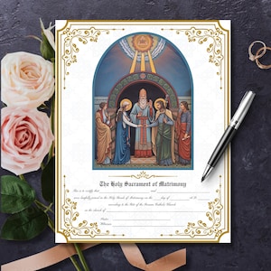 May include: A wedding certificate with ornate gold borders and the title "The Holy Sacrament of Matrimony." The document features a religious illustration of a marriage ceremony. A pen and rings are placed near the certificate.