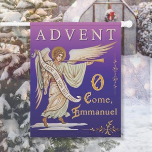 May include: A purple and blue Advent garden flag features an angel playing a trumpet. The flag has the word "ADVENT" at the top and the phrase "O Come, Emmanuel" at the bottom. The angel is wearing a white robe and has a gold halo.