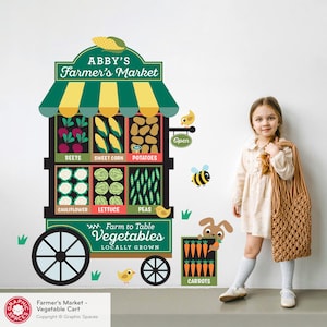 May include: A colorful wall decal featuring a farmer's market cart filled with vegetables. The cart displays beets, sweet corn, potatoes, cauliflower, lettuce, and peas. The text reads "Abby's Farmer's Market" and "Farm to Table Vegetables, Locally Grown."