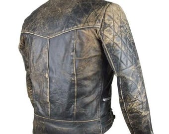 May include: Distressed brown leather jacket with quilted detailing on the shoulders and sleeves. The jacket has a zip closure and a collar.