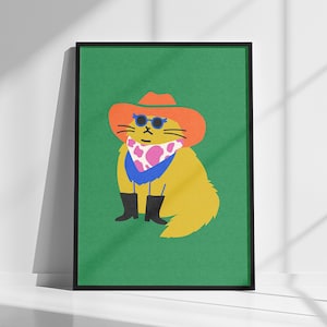 May include: A framed art print featuring a yellow cat wearing a cowboy hat, sunglasses, and a bandana. The cat is also wearing black boots. The background is a solid green color.